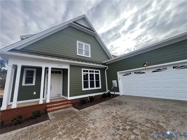 a front view of a house with a garage
