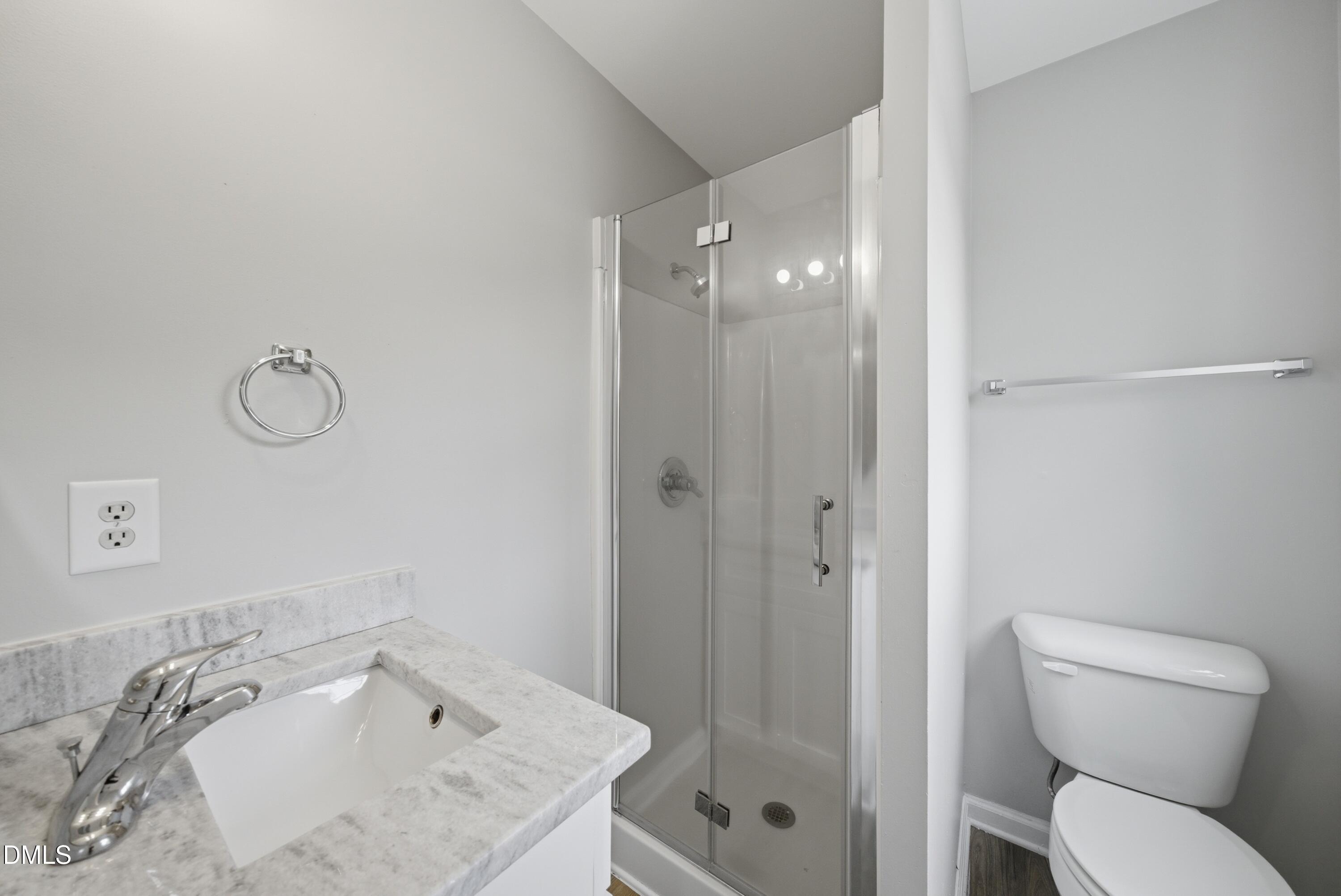 201 Tonylee Court, Unit A Raleigh, NC 27603 - Photo 24 of 30 a bathroom with a granite countertop sink toilet and shower