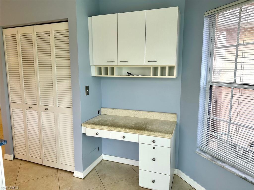 2525 Sailors Way, Unit 139 Naples, FL 34109 - Photo 6 of 20 Unfurnished office with light tile patterned floors and built in desk