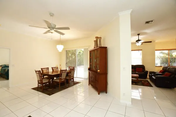 a bedroom with a bed and ceiling fan