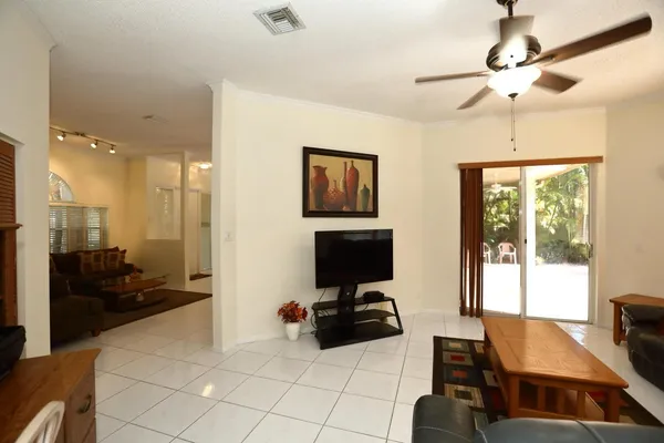 a view of a livingroom with furniture and a ceiling fan