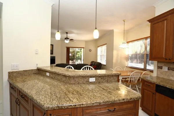 a bathroom with a double vanity sink mirror and toilet