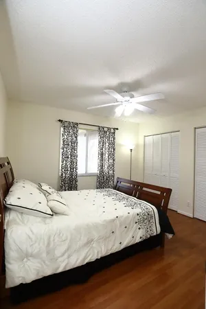 a front view of a house with yard patio and green space