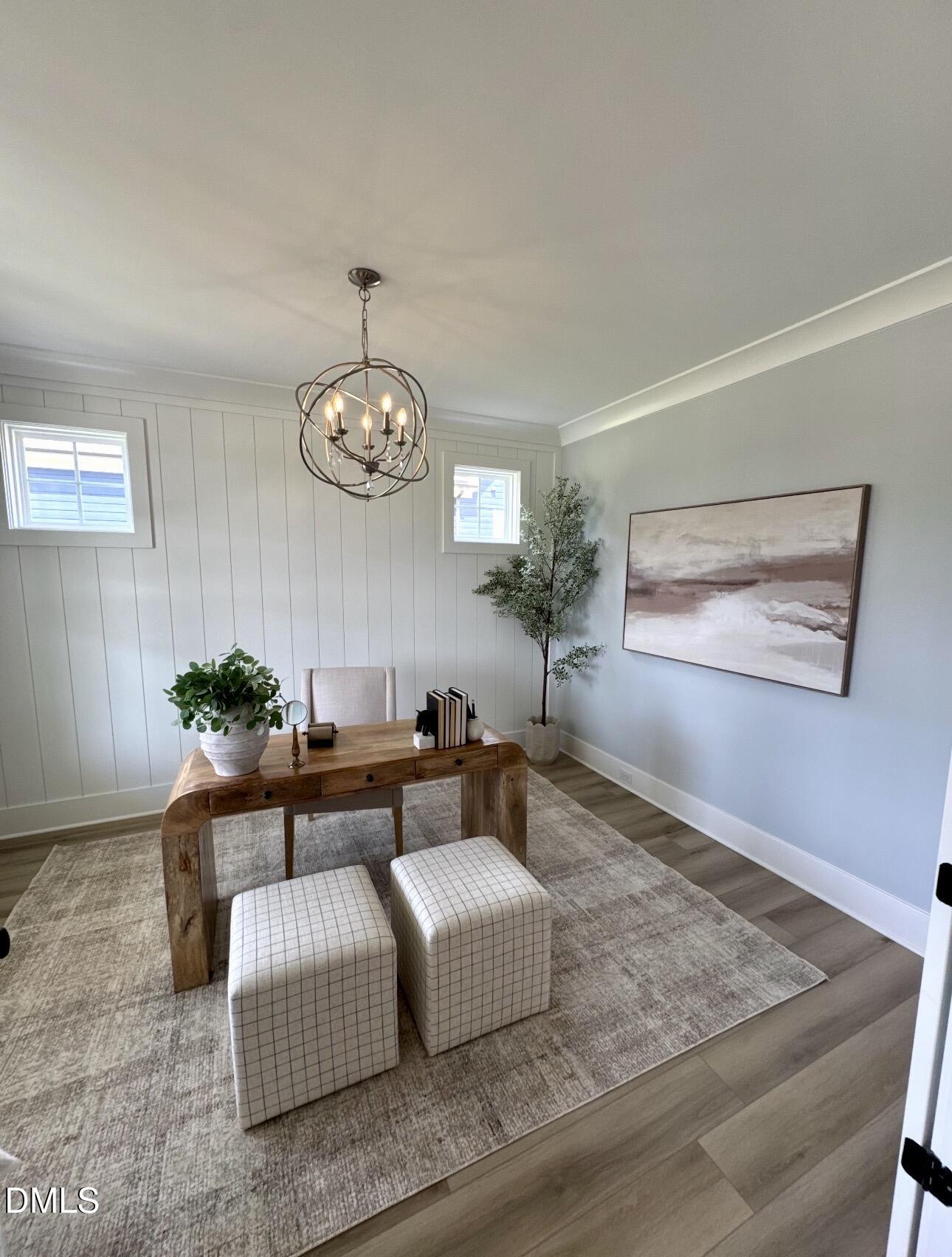 1057 Azalea Garden Circle Raleigh, NC 27603 - Photo 6 of 20 a living room with furniture and a chandelier