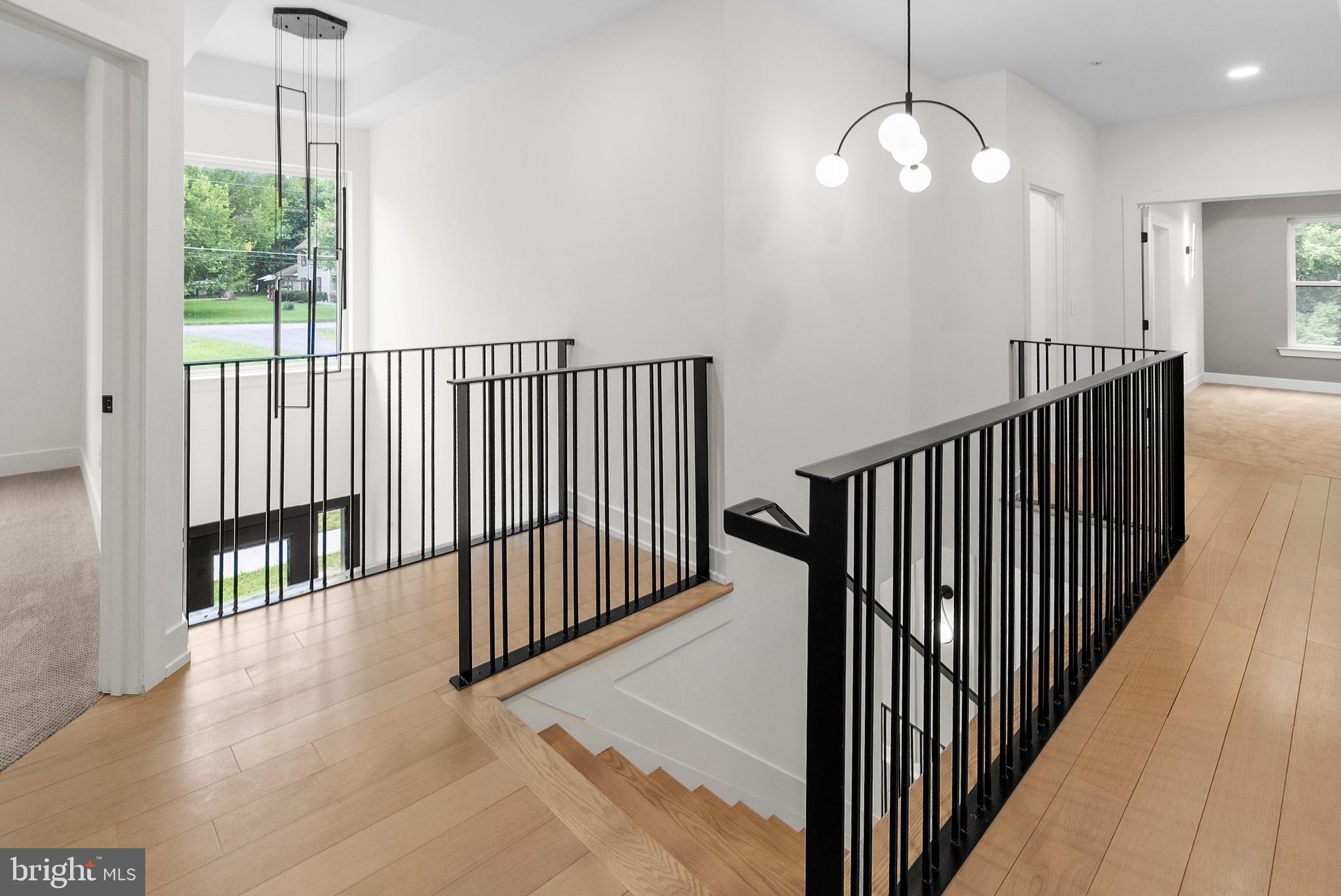 1321 Nicodemus Road Reisterstown, MD 21136 - Photo 10 of 30 a view of a hallway with wooden floor and chandelier