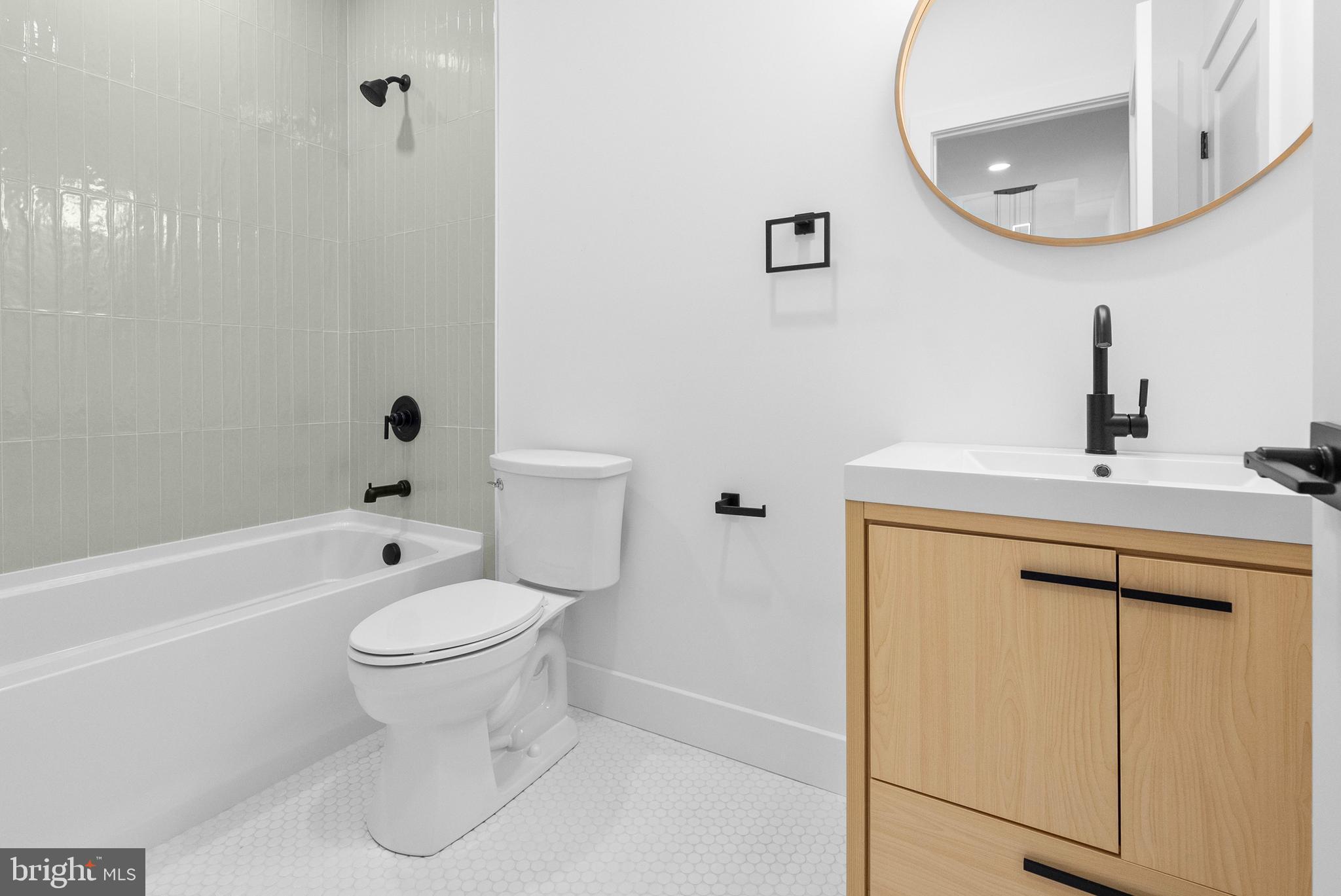 1321 Nicodemus Road Reisterstown, MD 21136 - Photo 13 of 30 a bathroom with a sink toilet and a mirror