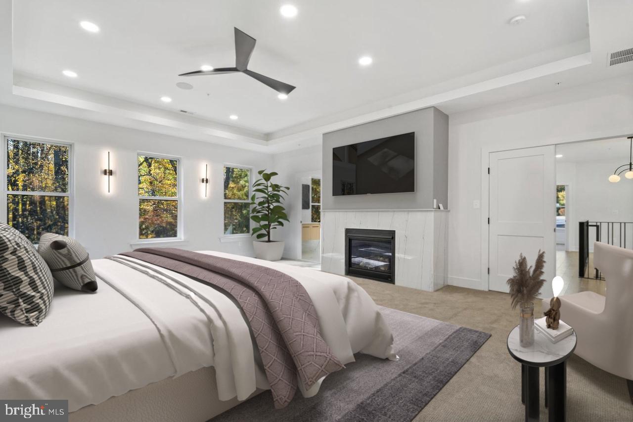 1321 Nicodemus Road Reisterstown, MD 21136 - Photo 17 of 30 a spacious bedroom with a balcony a bed and a flat screen tv