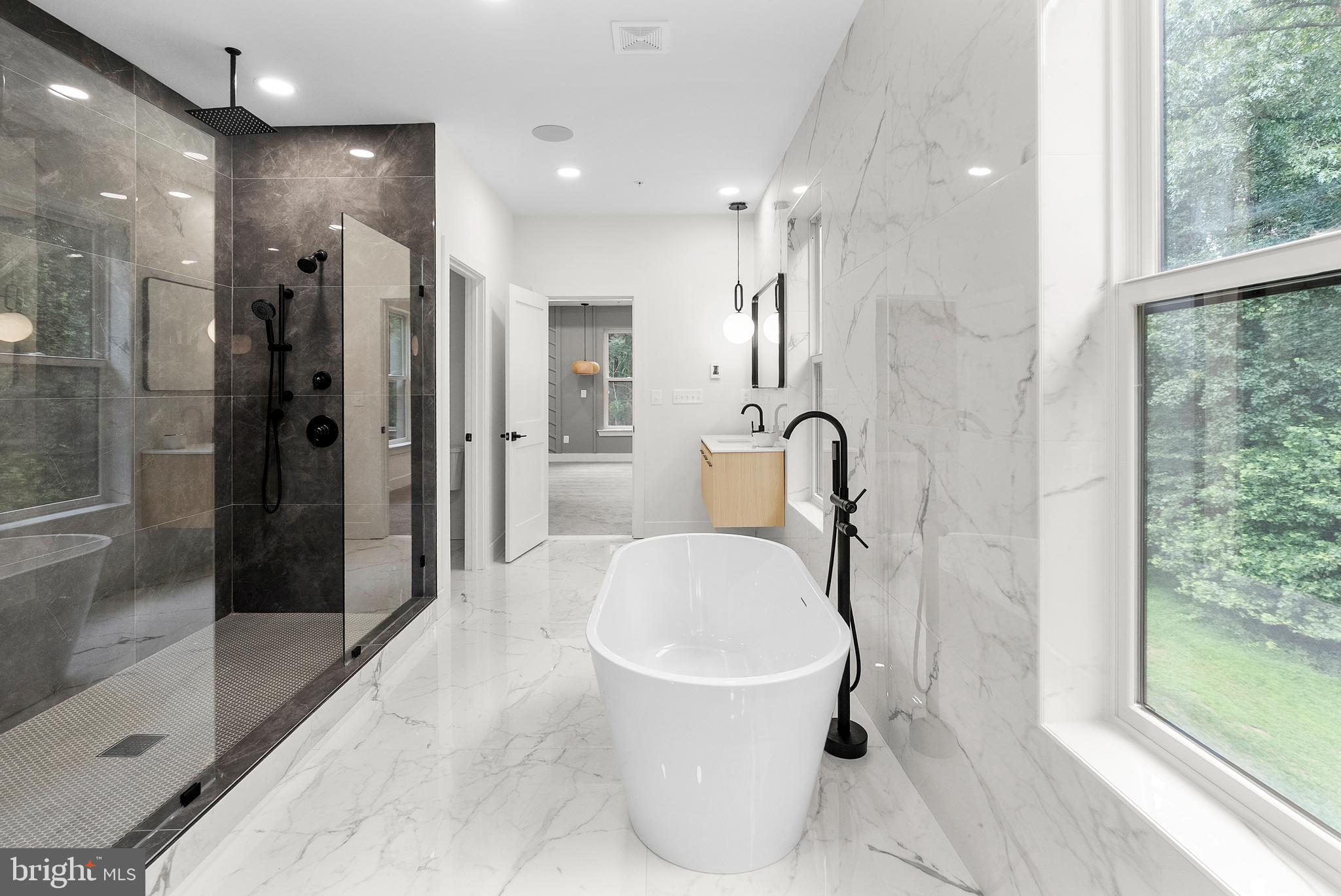 1321 Nicodemus Road Reisterstown, MD 21136 - Photo 23 of 30 a bathroom with a granite countertop sink a toilet and shower