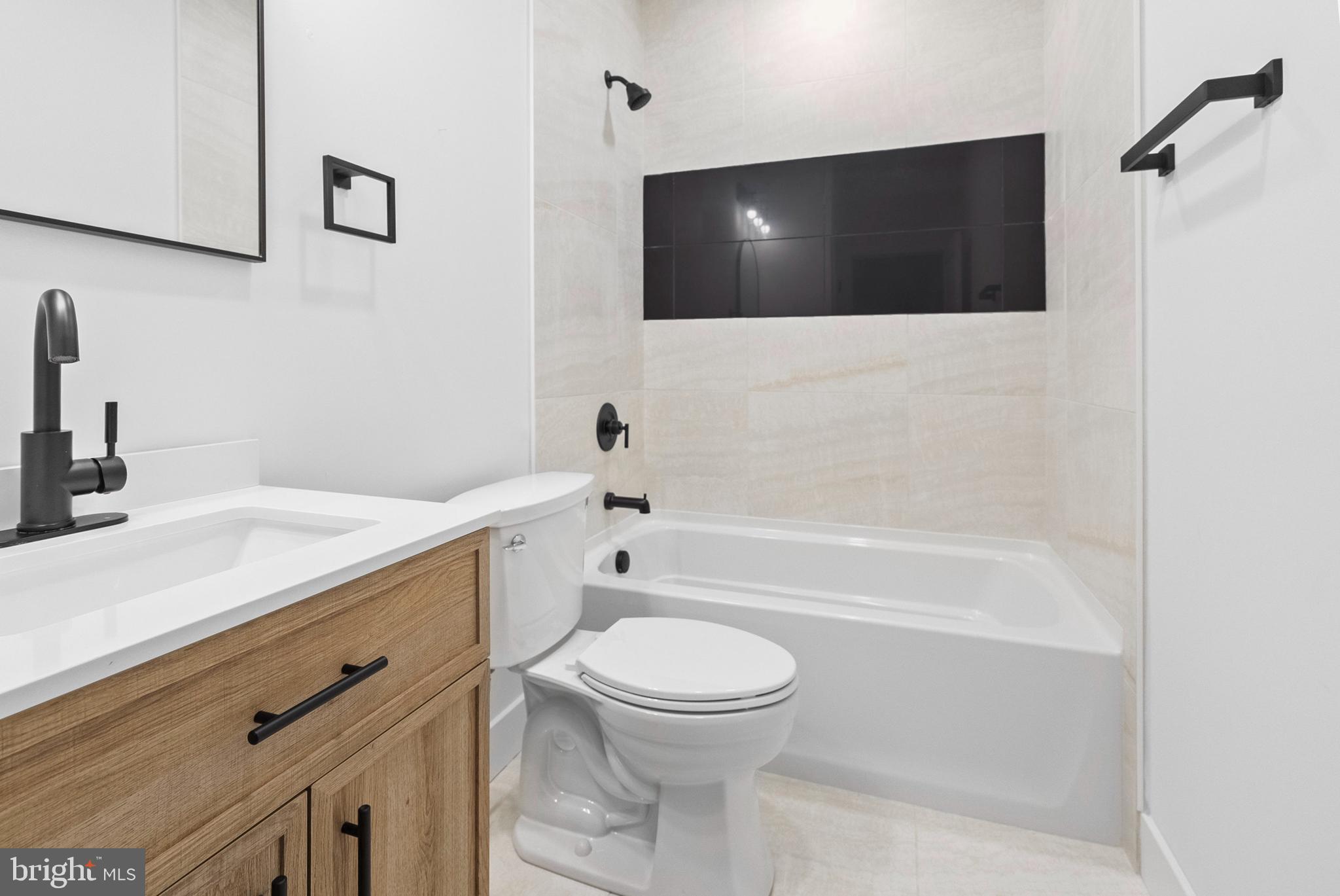 1321 Nicodemus Road Reisterstown, MD 21136 - Photo 26 of 30 a bathroom with a toilet a sink and bathtub