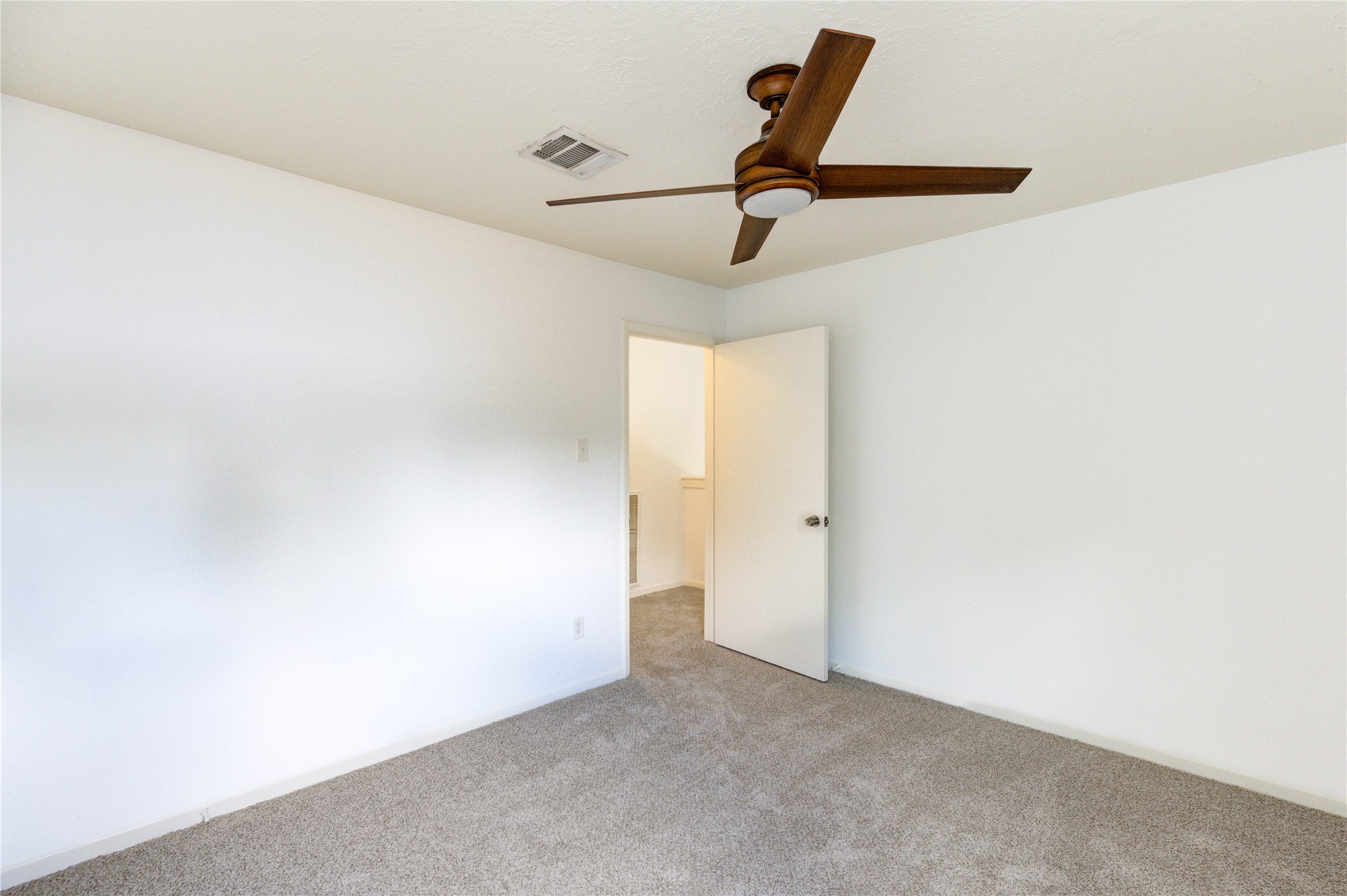 3639 Fir Forest Drive Spring, TX 77388 - Photo 32 of 44 a view of a room with a ceiling fan and wooden floor
