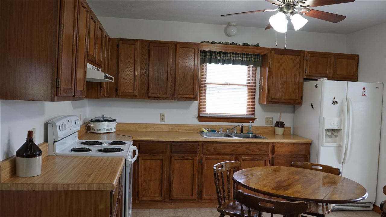 11 Ruger Lane Swoope, VA 24479 - Photo 9 of 17 a kitchen with a table chairs sink and cabinets