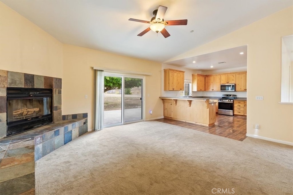 76846 Ranchita Canyon Road San Miguel, CA 93451 - Photo 11 of 51 a view of a kitchen with a stove cabinets a ceiling fan and a kitchen