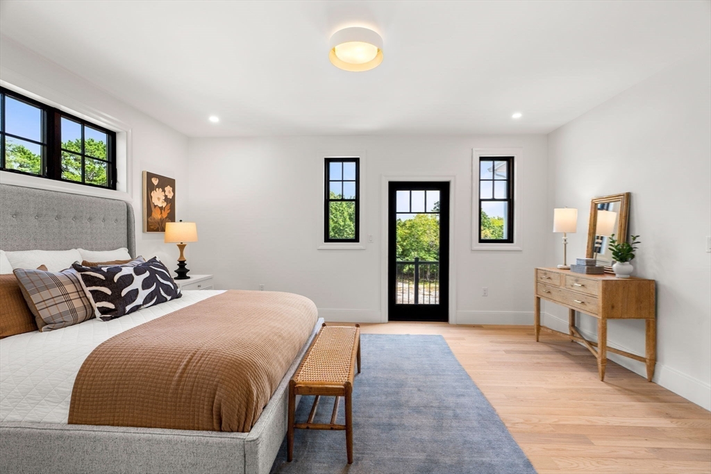 226 Atlantic Street Gloucester, MA 01930 - Photo 15 of 37 a spacious bedroom with two beds and a chair