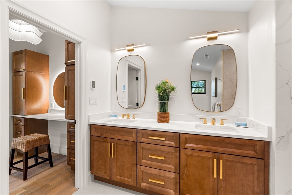 226 Atlantic Street Gloucester, MA 01930 - Photo 25 of 37 a bathroom with a double vanity sink and a mirror