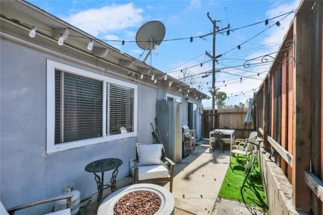 a dining room with furniture a chandelier and a rug