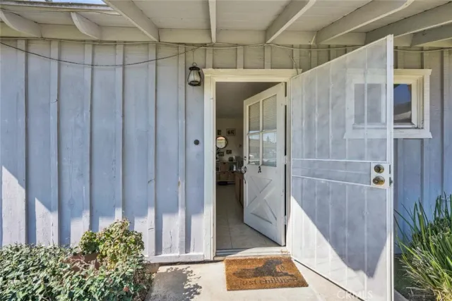 a bathroom with a shower and a glass door