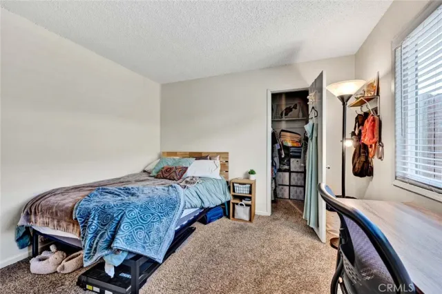 a living room with furniture gym equipment and a window