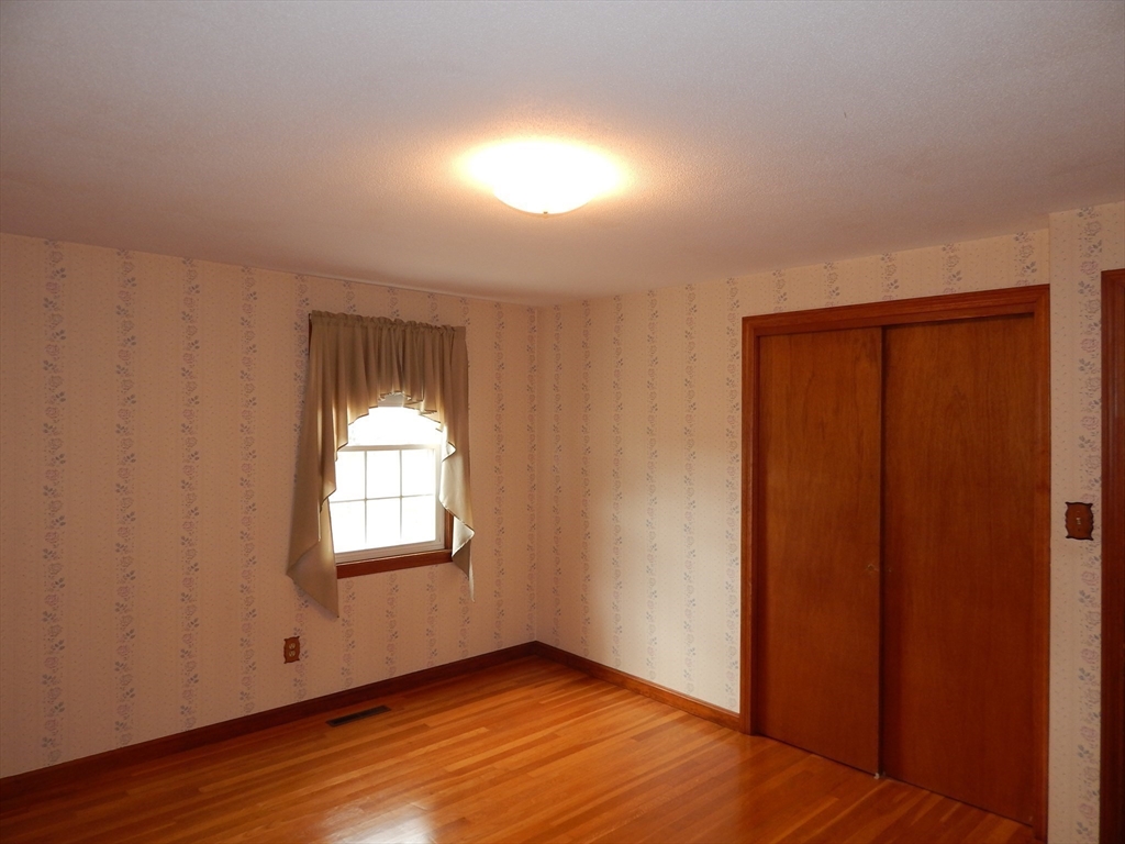 8 Chester Street Montague, MA 01376 - Photo 18 of 32 an empty room with wooden floor closet and windows