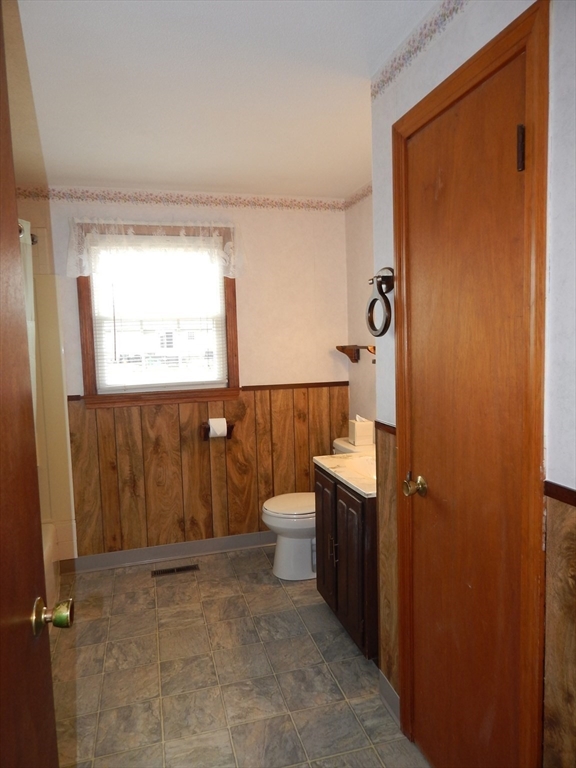 8 Chester Street Montague, MA 01376 - Photo 19 of 32 a bathroom with a toilet a sink and mirror