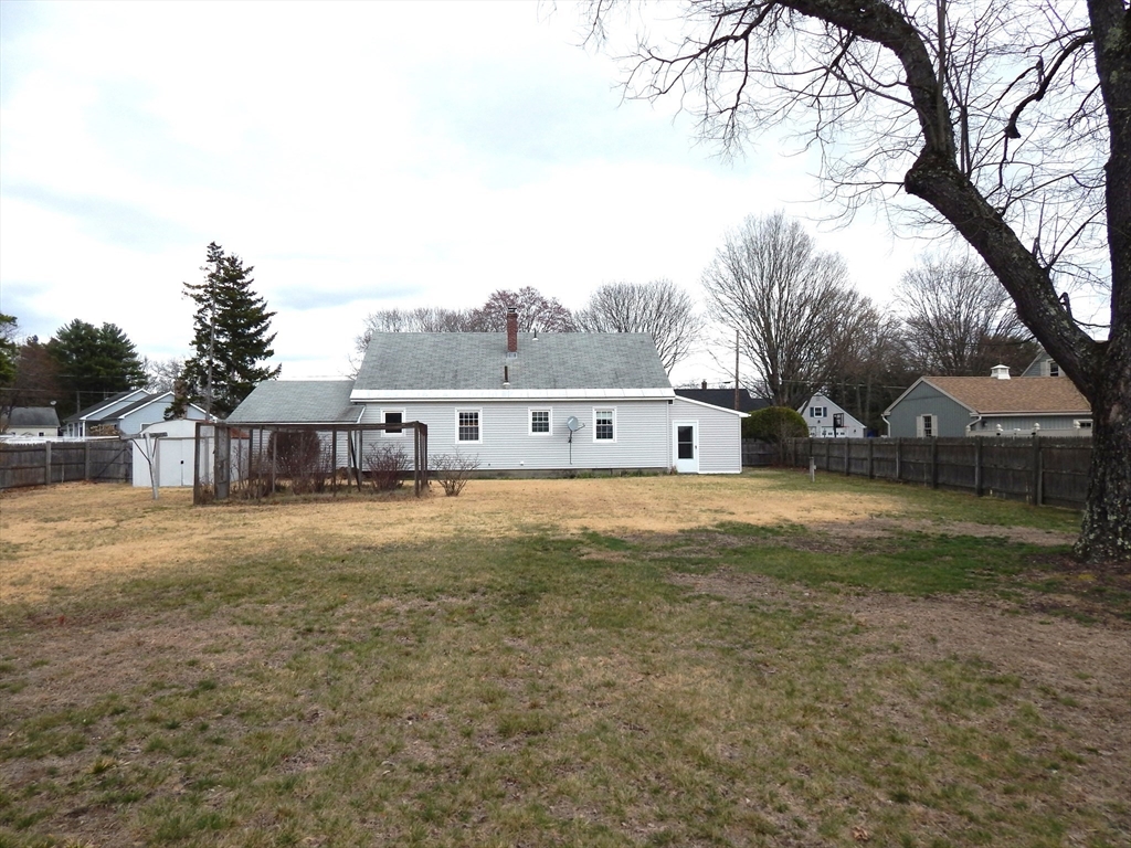 8 Chester Street Montague, MA 01376 - Photo 2 of 32 a front view of a house with a yard and large trees