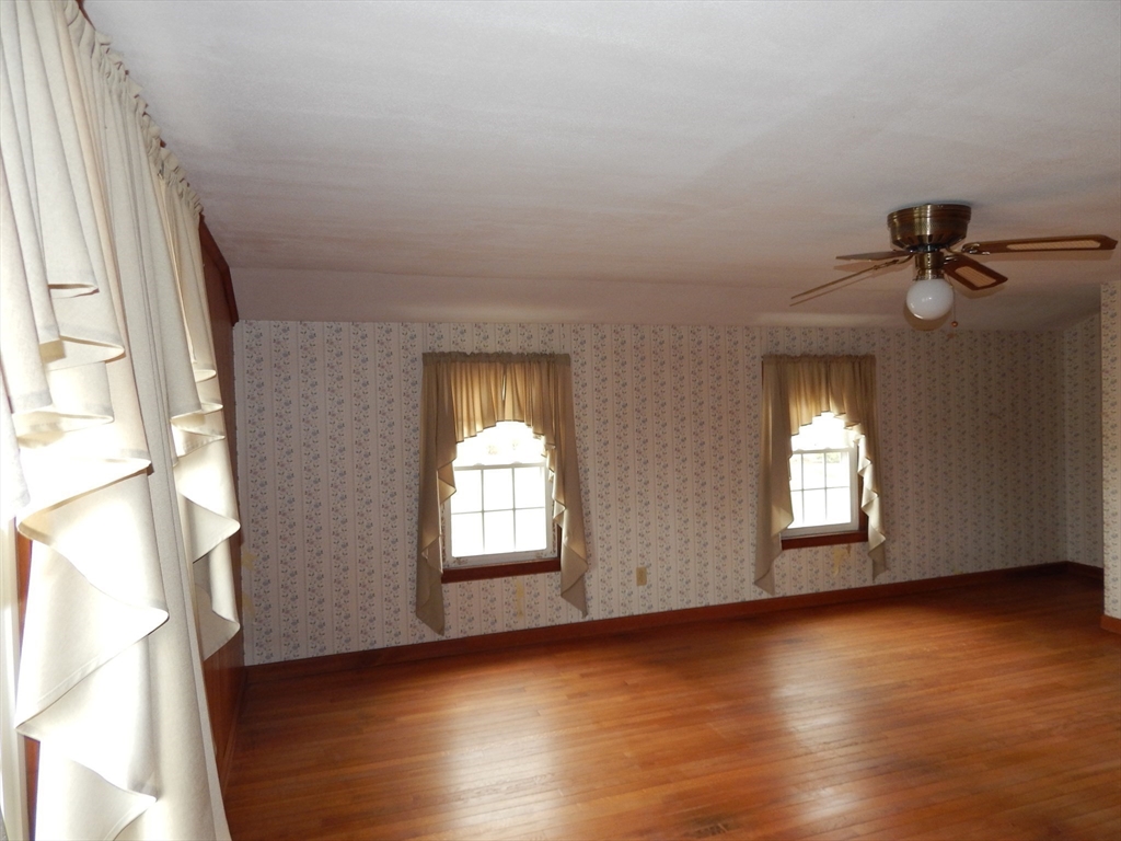 8 Chester Street Montague, MA 01376 - Photo 23 of 32 an empty room with wooden floor and windows