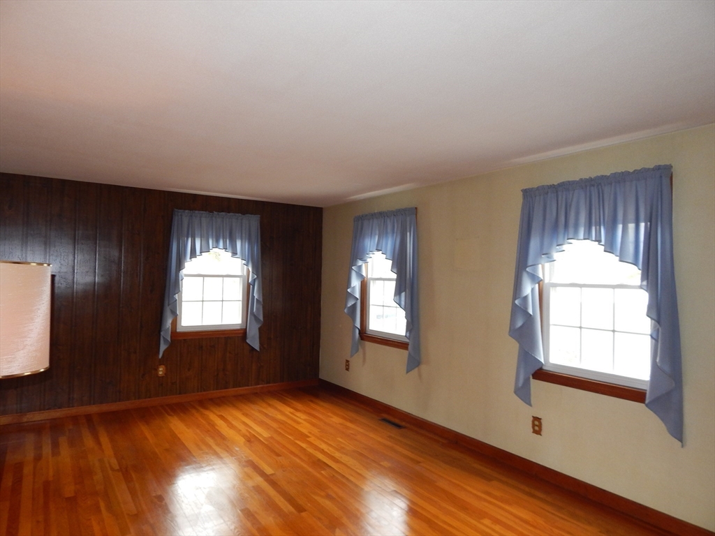 8 Chester Street Montague, MA 01376 - Photo 10 of 32 a view of an empty room with wooden floor and a window