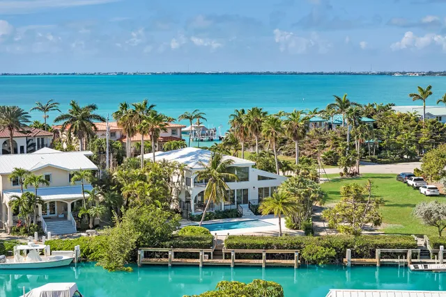 a large kitchen with stainless steel appliances kitchen island granite countertop a sink and cabinets