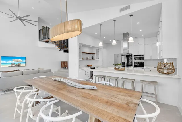 a kitchen with stainless steel appliances kitchen island granite countertop a sink and cabinets