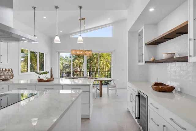 a bedroom with a large bed and a large window