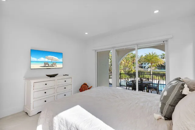 a bedroom with a bed and a white cabinets