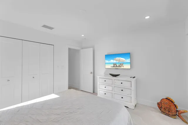 a bedroom with furniture and a table