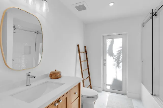 a bed room with a bed and a large window