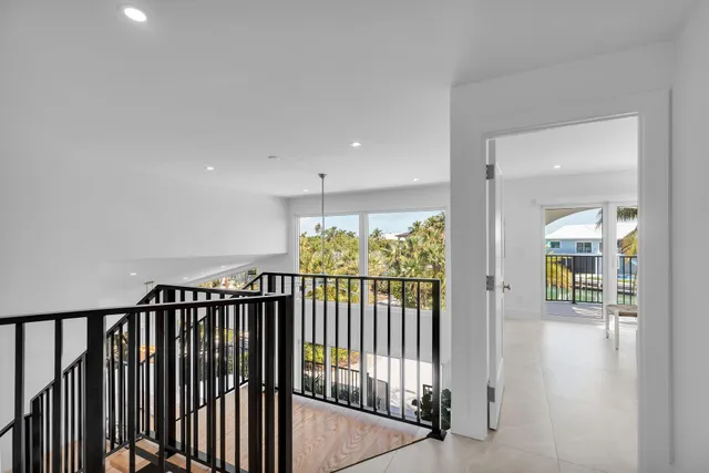 a bedroom with a large bed and a large window
