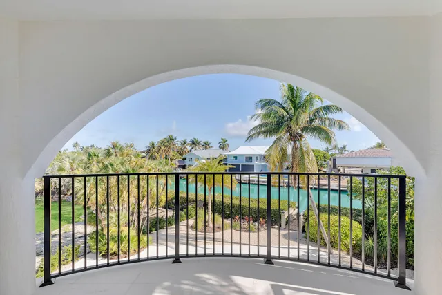 a spacious bathroom with a tub sink and mirror