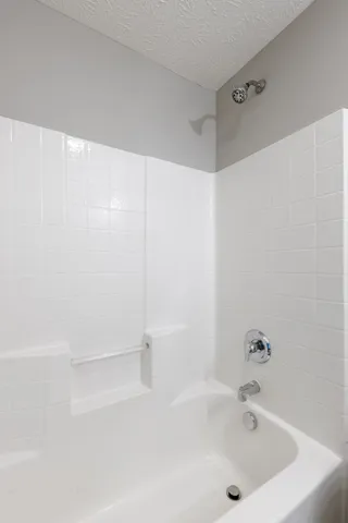 a view of a house with a yard and plants