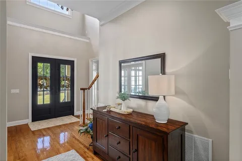 a large kitchen with lots of counter space a sink refrigerator dining table and chairs