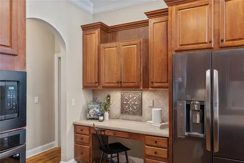 a large bathroom with a double vanity sink a toilet a mirror and shower