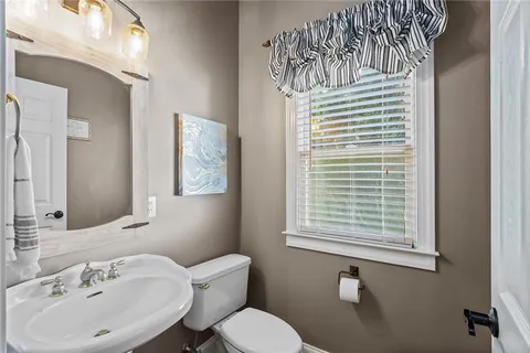 a bathroom with a sink vanity and a mirror