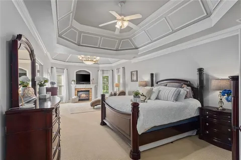 a bed room with a bed and a chair