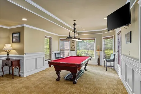 a view of a swimming pool and a chairs