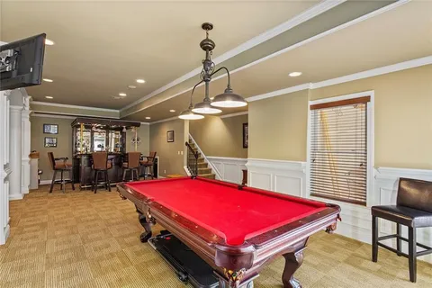 a view of a swimming pool with a chair and tables
