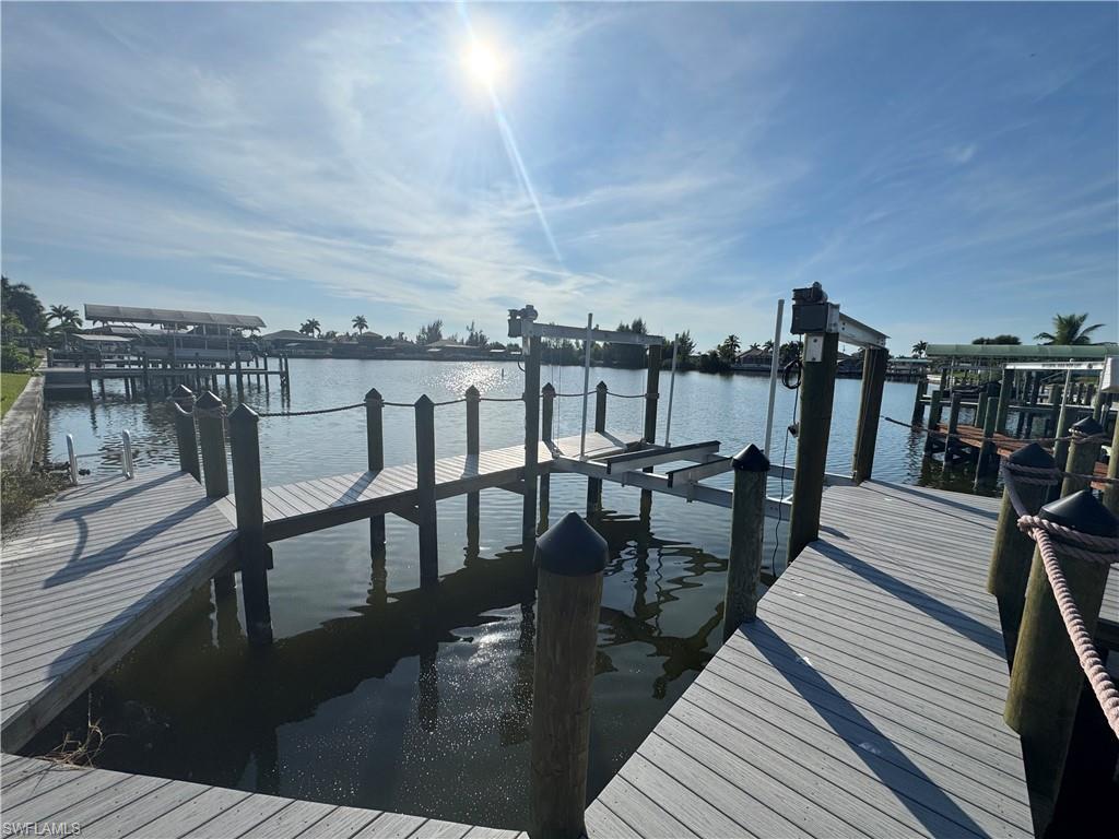 430 Burnt Store Road Cape Coral, FL 33991 - Photo 6 of 7 a view of a balcony with chairs and wooden floor