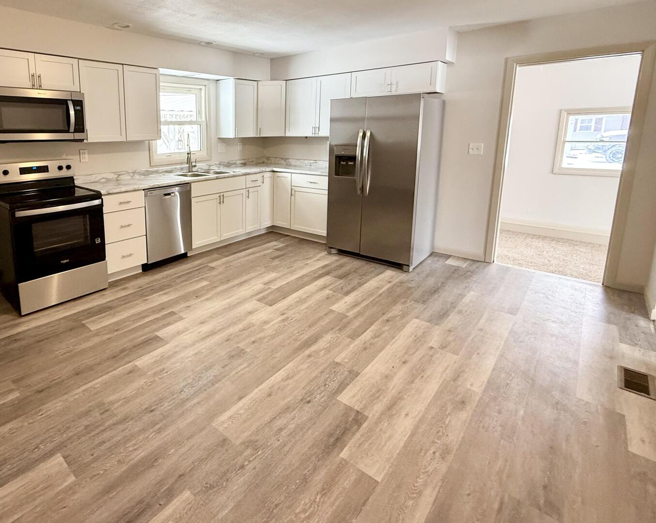 281 East Sprague Street Bement, IL 61813 - Photo 15 of 24 a kitchen with stainless steel appliances a refrigerator sink and stove