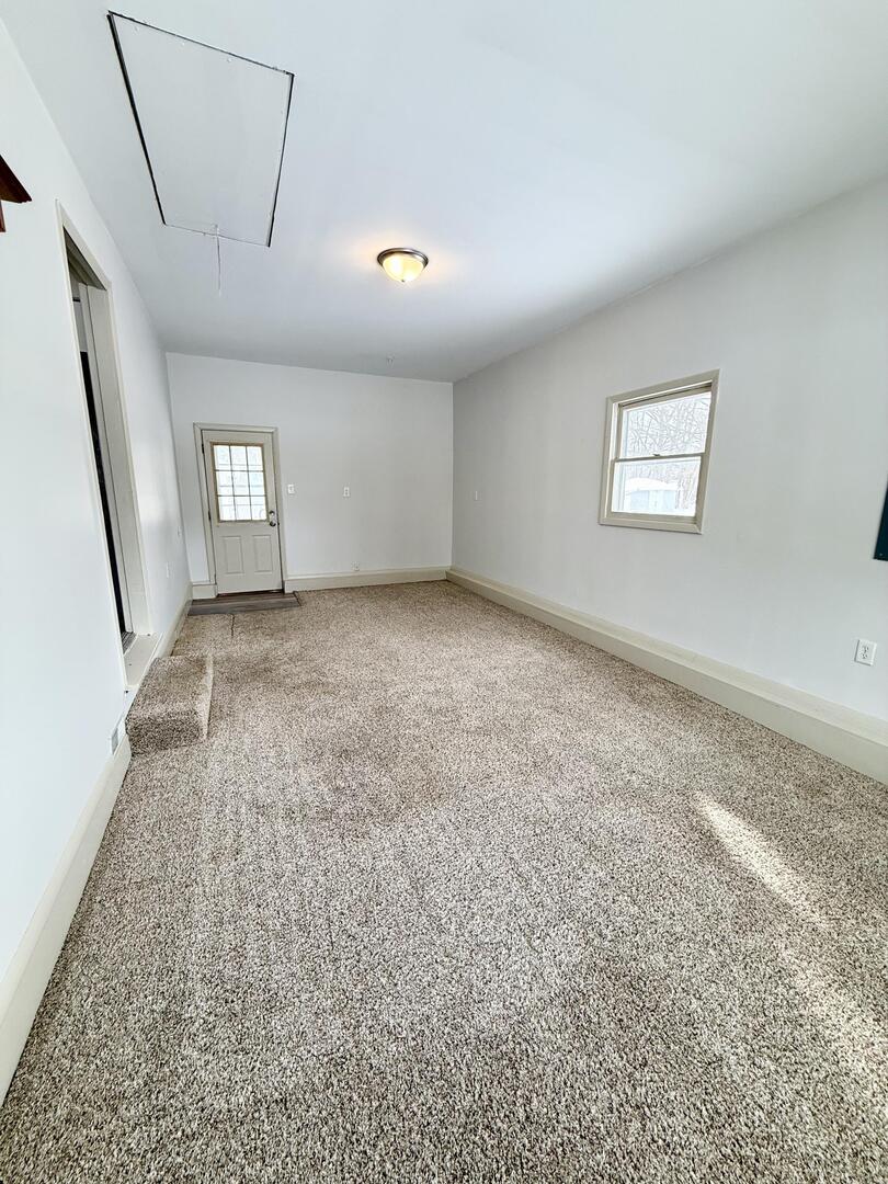 281 East Sprague Street Bement, IL 61813 - Photo 20 of 24 an empty room with windows