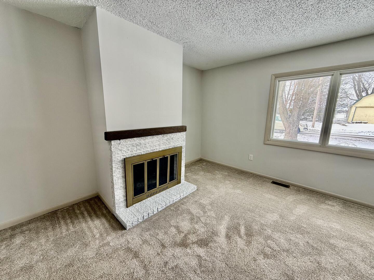 281 East Sprague Street Bement, IL 61813 - Photo 5 of 24 a view of empty room with windows