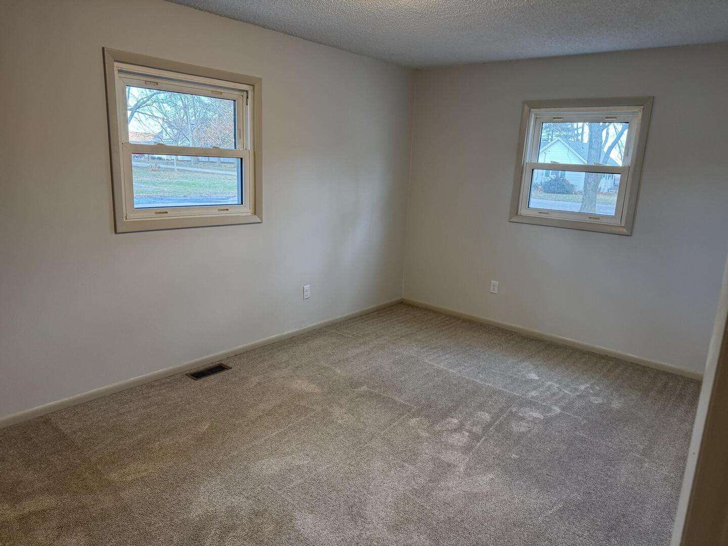 281 East Sprague Street Bement, IL 61813 - Photo 8 of 24 an empty room with windows
