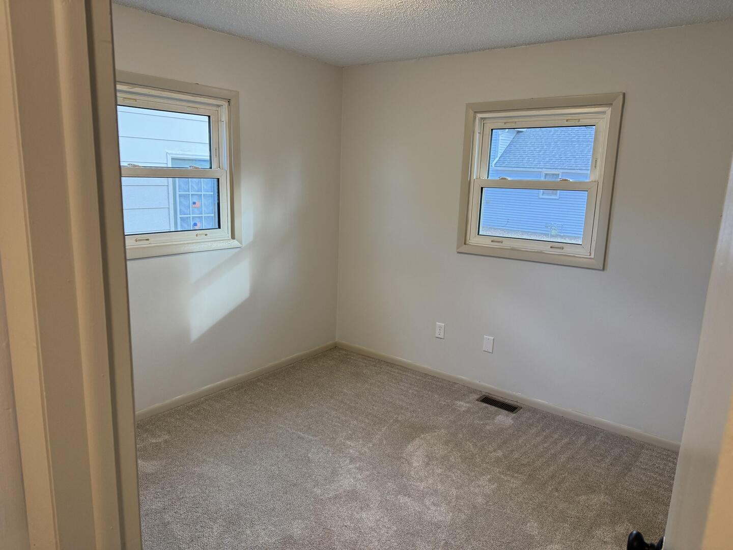281 East Sprague Street Bement, IL 61813 - Photo 10 of 24 an empty room with a window