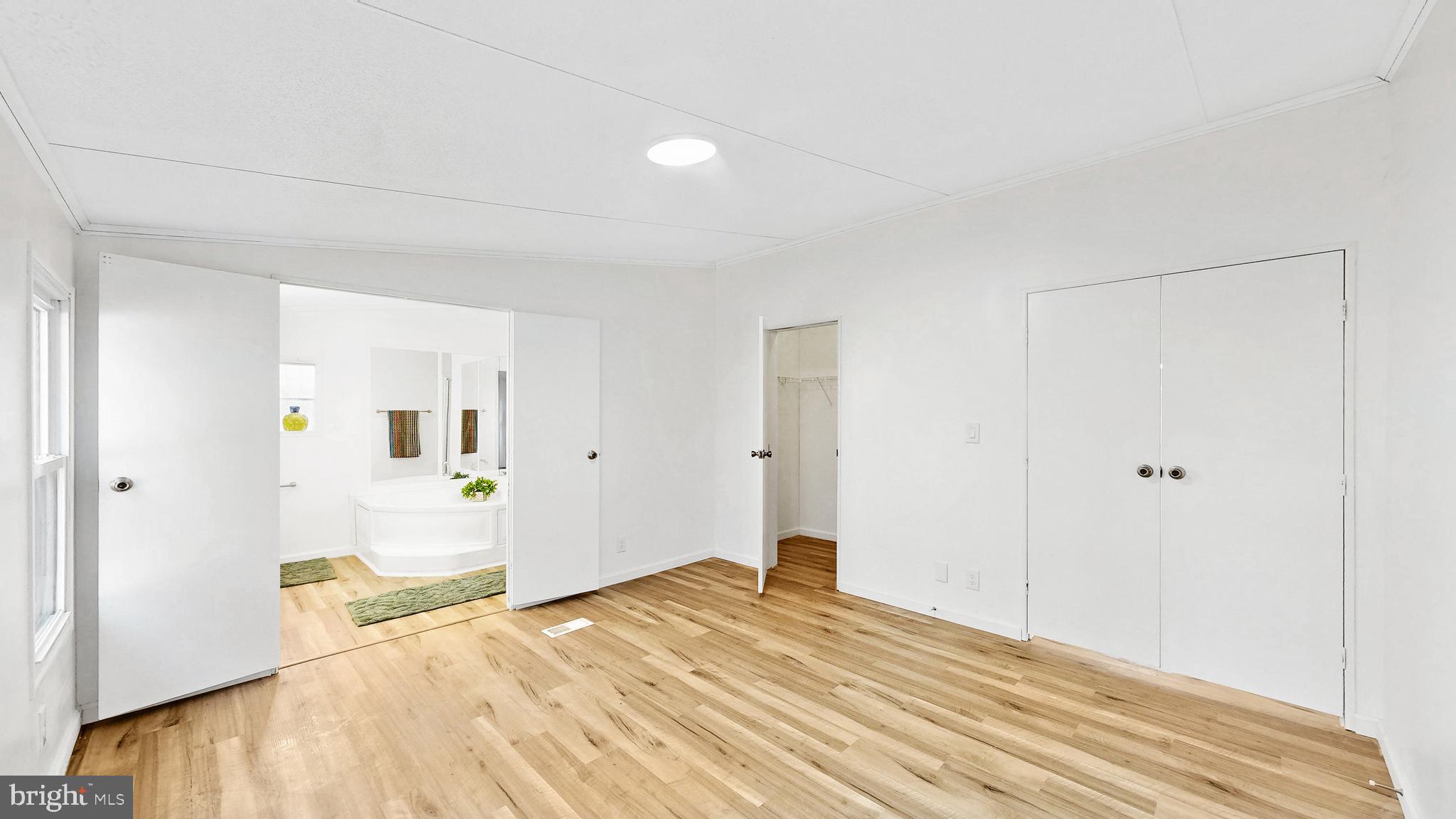 224 Shamrock Avenue Dover, DE 19901 - Photo 16 of 52 a bedroom with a bed and wooden floor