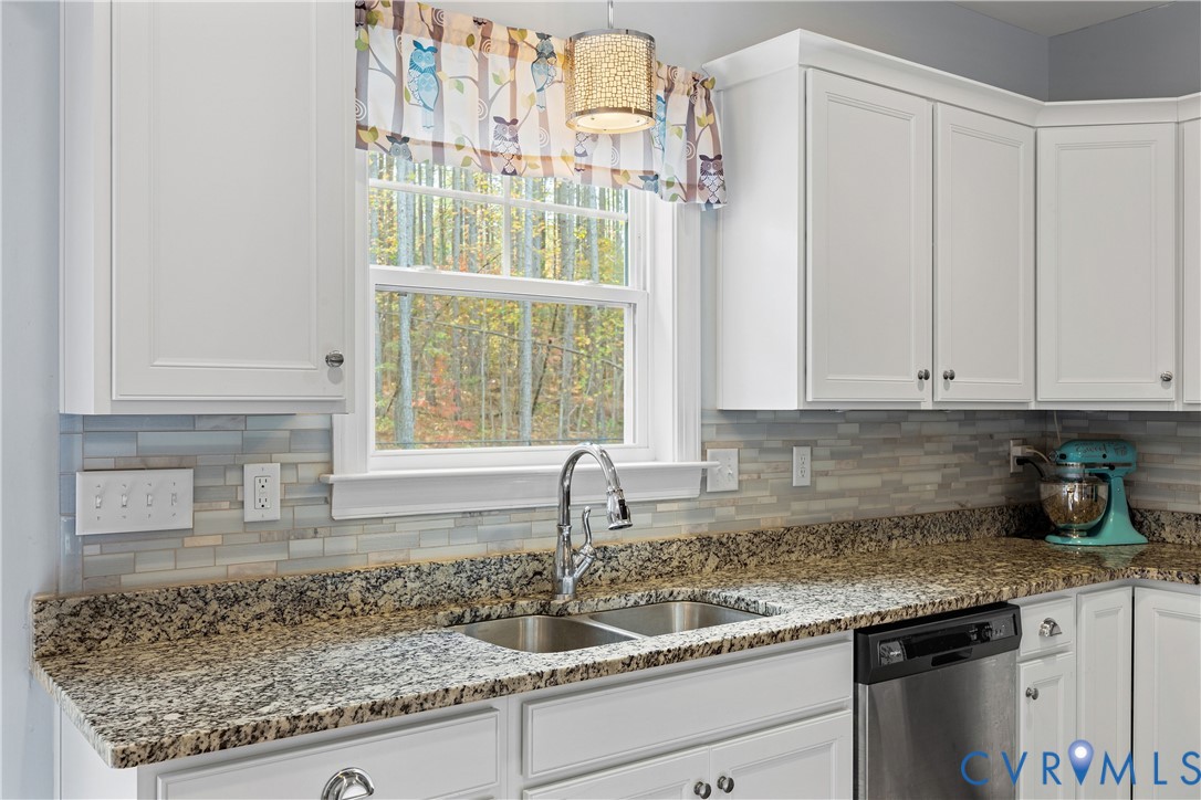 4875 Kimber Lane Gum Spring, VA 23065 - Photo 22 of 48 Kitchen with white cabinetry, dark stone counterto