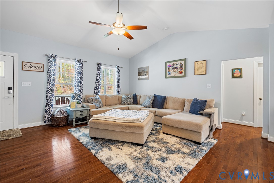 4875 Kimber Lane Gum Spring, VA 23065 - Photo 29 of 48 a living room with furniture and a chandelier